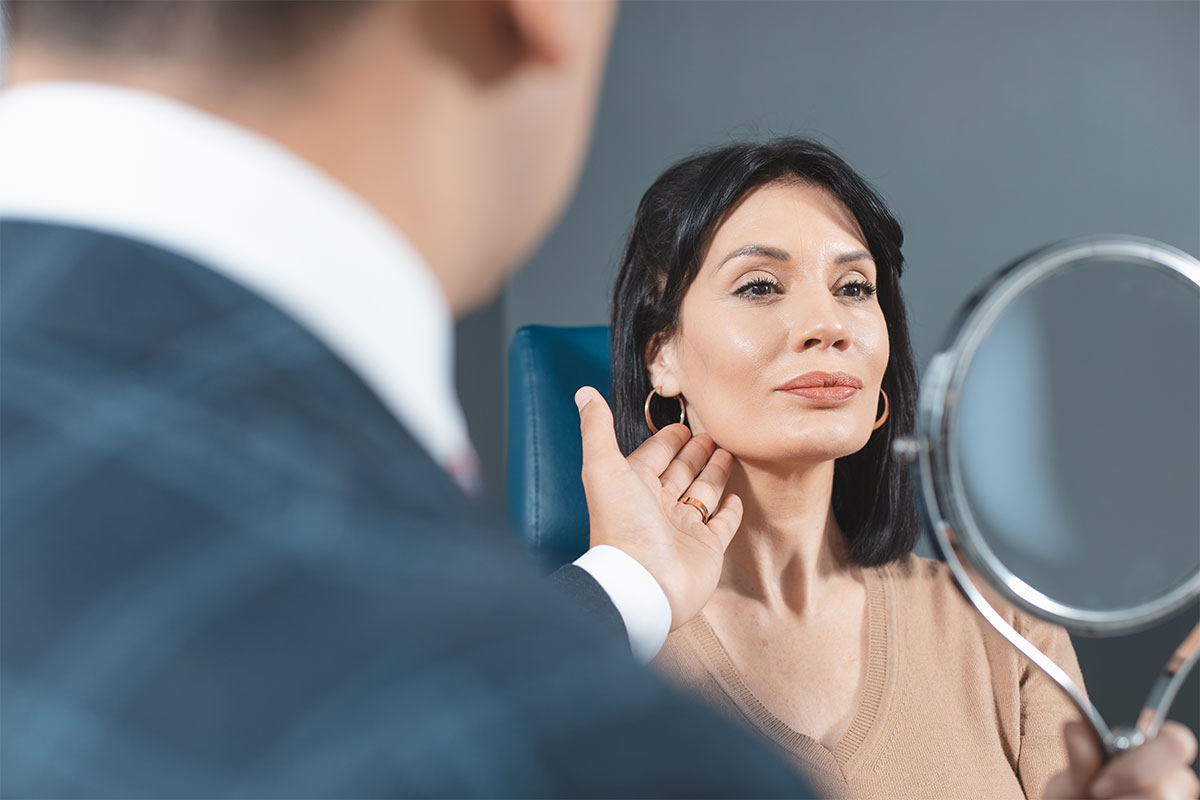 woman during consultation for neck liposuction in NYC